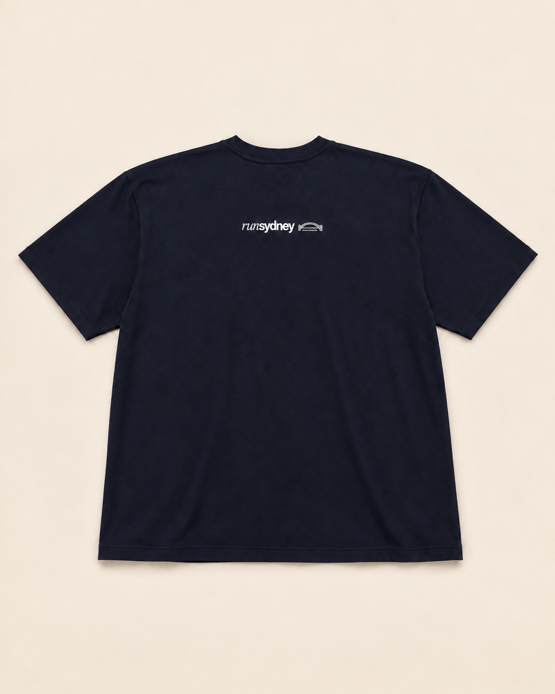 Back view of the deep navy Social Miles Sydney crest runSydney tee with the runSydney mark across the upper back.