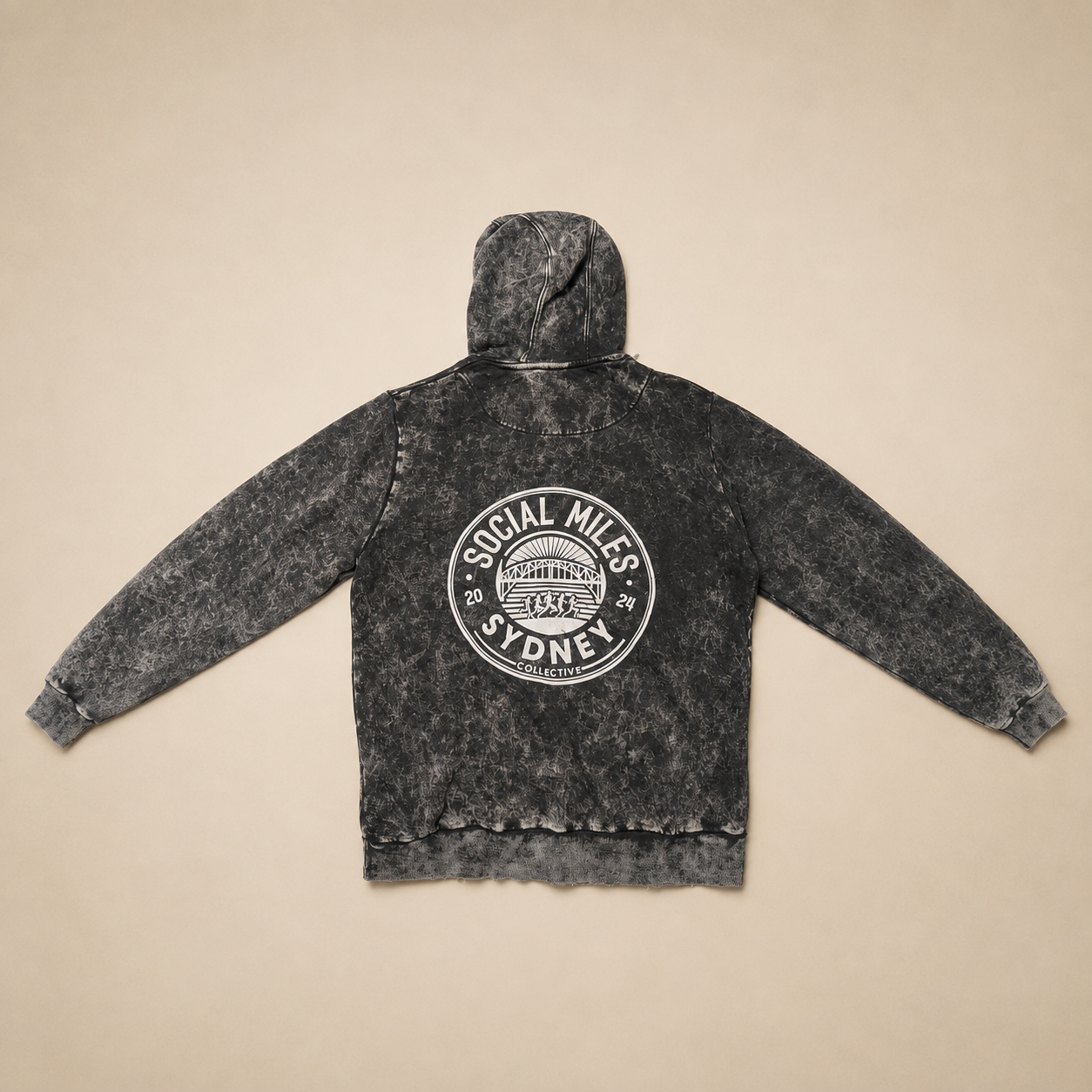 Back view of the black stonewash Social Miles Sydney hoodie with the large white Social Miles Sydney 2024 Collective crest.