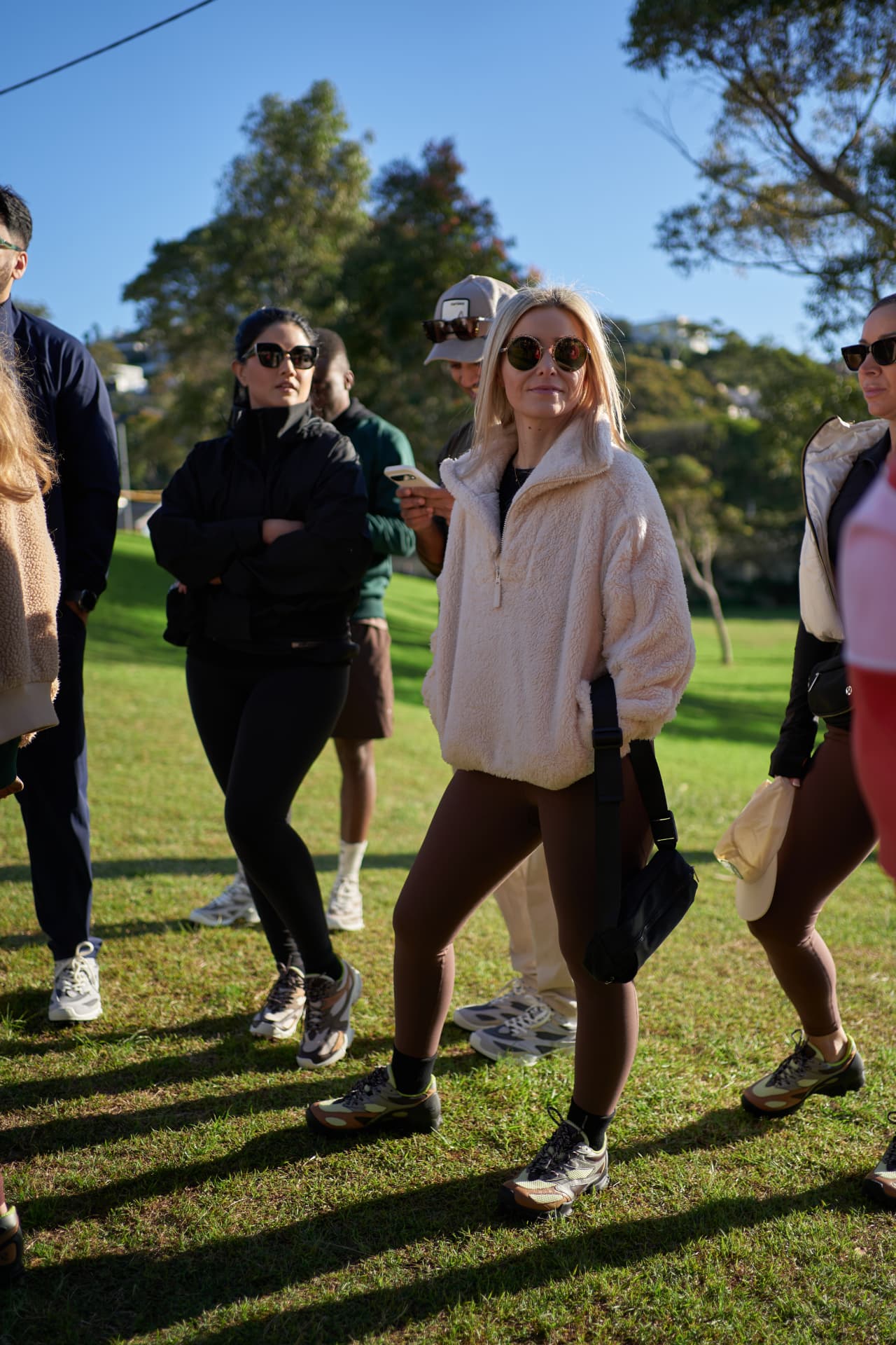 A group of Social Miles Sydney members standing together in the sun at a community morning.