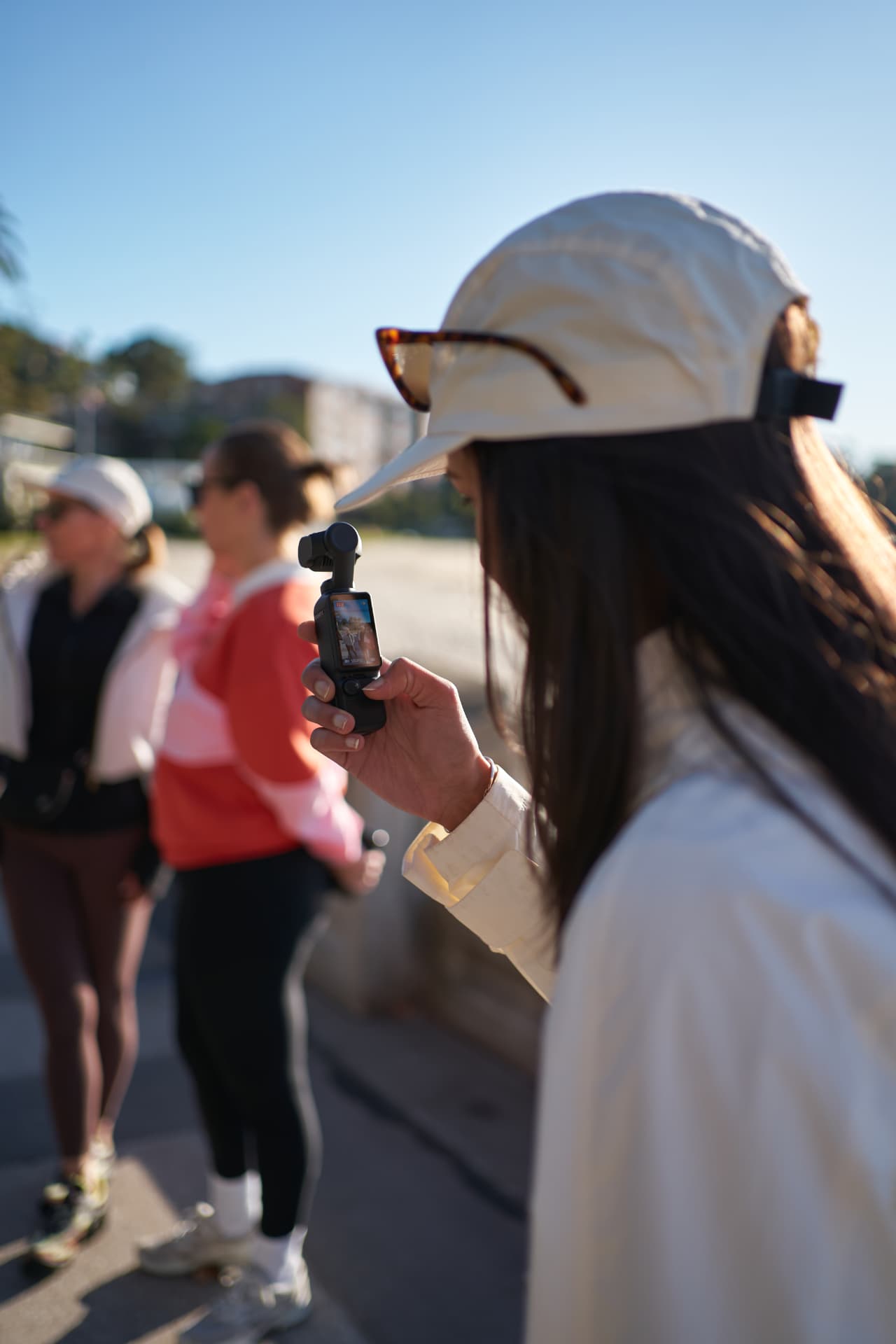 A Social Miles Sydney member filming the club gathering on a small camera.