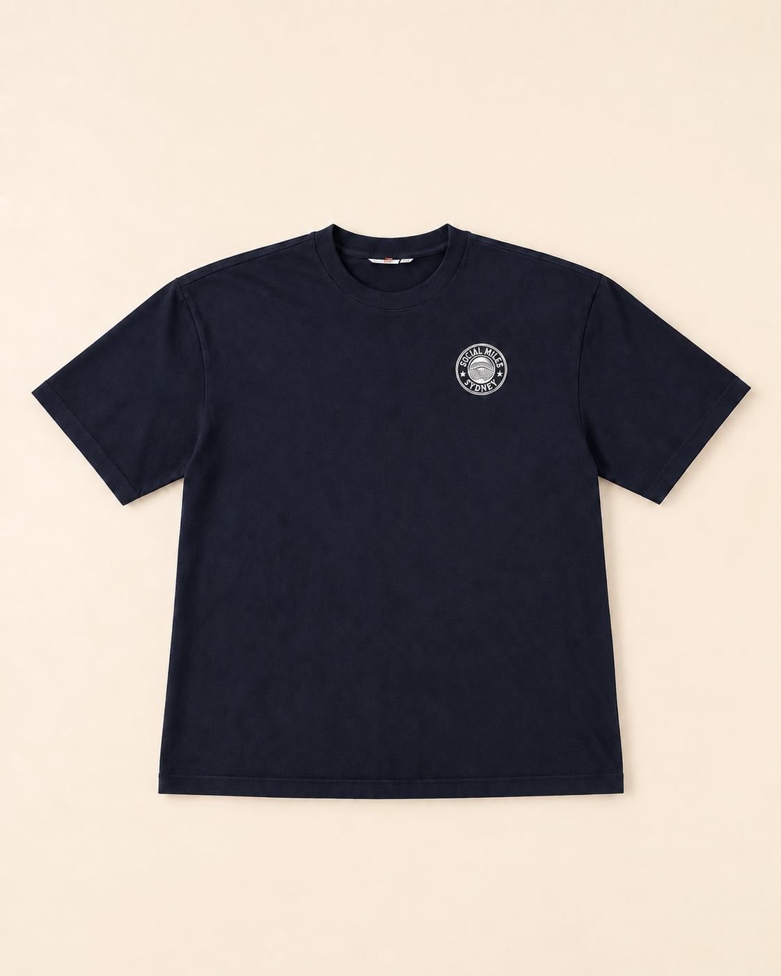 Front view of the deep navy Social Miles Sydney crest runSydney tee with the circular club crest on the chest.