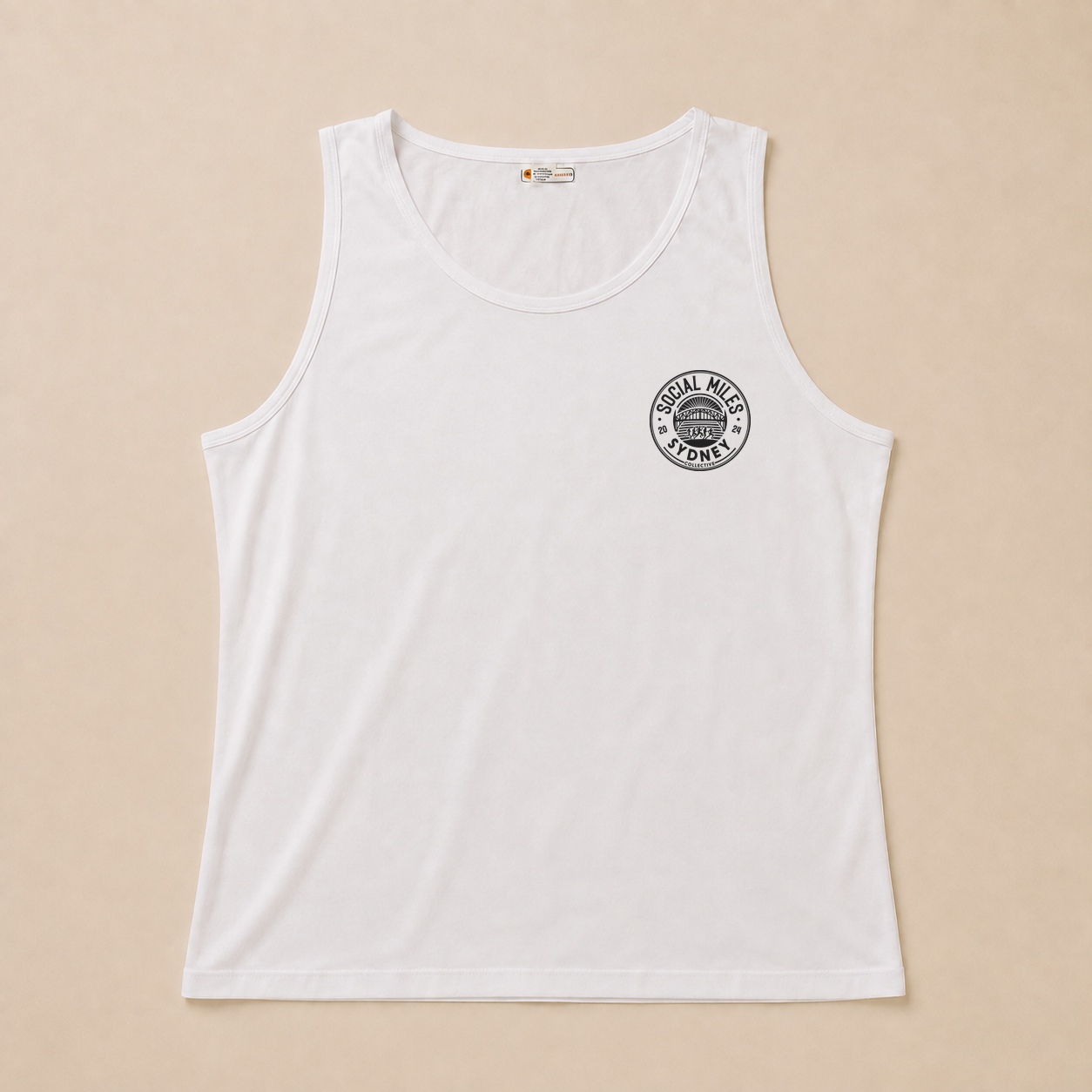 Front view of the white Social Miles Sydney runSydney singlet with the small dark circular club crest at the chest.