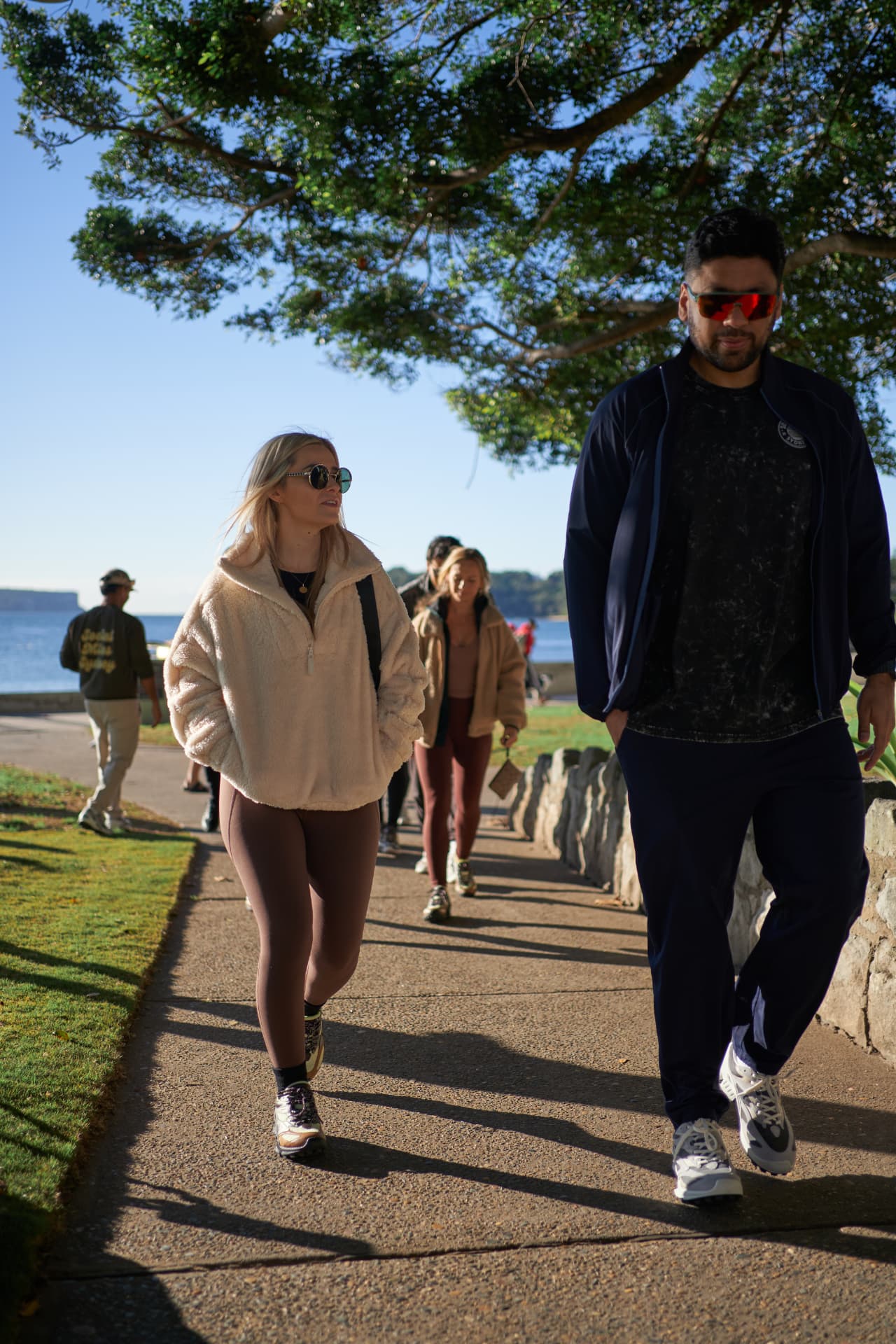 Two Social Miles Sydney members walking together along the waterfront.