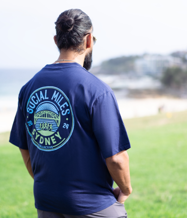 Back view of the navy oversized Social Miles Sydney club tee with the circular Sydney crest across the back.